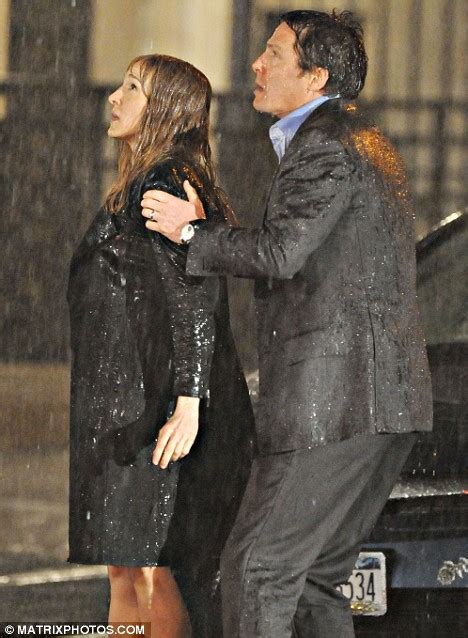 from soppy to sopping wet hugh grant and sarah jessica parker find it s murder in the rain
