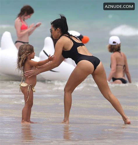 Kourtney Kardashian Sexy In A New Black Swimsuit With Larsa Pippen In