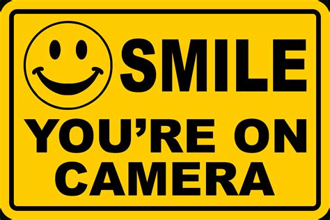 smile youre  camera signs    video taped
