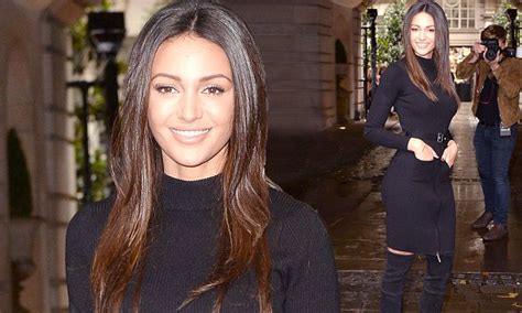 michelle keegan in a black bodycon dress and thigh high boots at clothing launch daily mail online