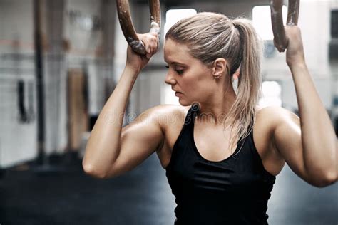 Fit Young Woman Sweating During A Gym Workout With Rings Stock Image