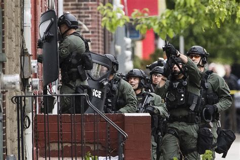 police standoff with shooting suspect enters second day