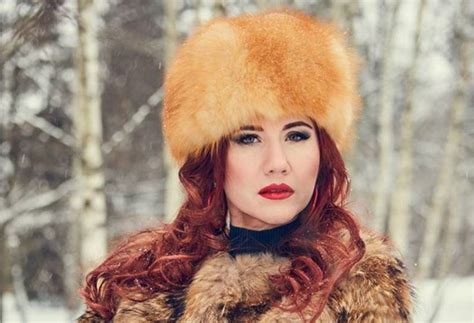sexy redheaded russian spy booted from us mixes glam photos with
