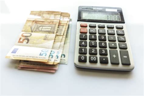 banknotes  calculator euro banknotes  white background stock image image  investment
