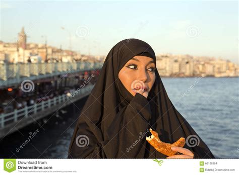 Woman Dressed Black Headscarf Chador Eating Simit