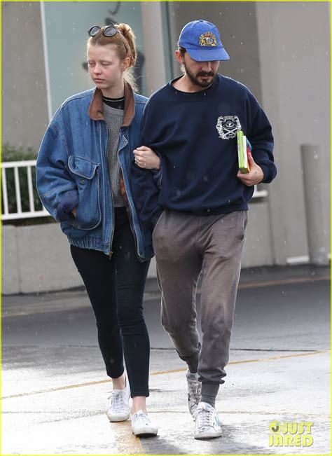 shia labeouf and mia goth get caught in the rain before nye photo