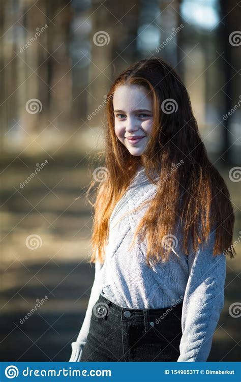 cute teen girl with fiery red hair in the pine park stock image image