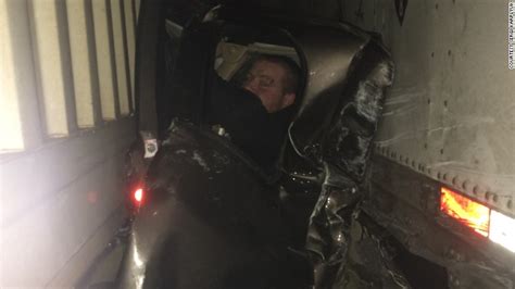 oregon driver pinned between semi trucks survives cnn