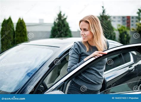 young woman    car  town stock image image  sweater young