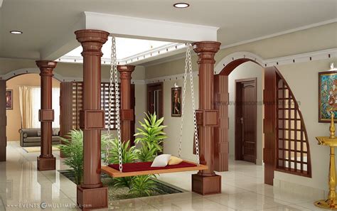 kerala home  courtyard wooden pillers small courtyard open roof   living area wood