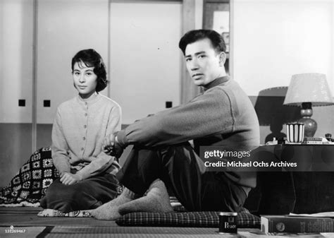 Yoshiko Kuga And Keiji Sada Sitting In The Living Room In A Scene
