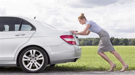 lady pushing car eac telford