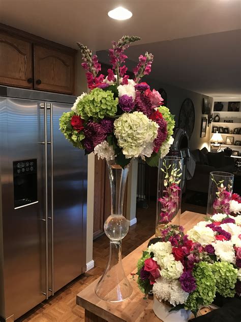 colorful tall centerpiece  trumpet vase wedding floral centerpieces
