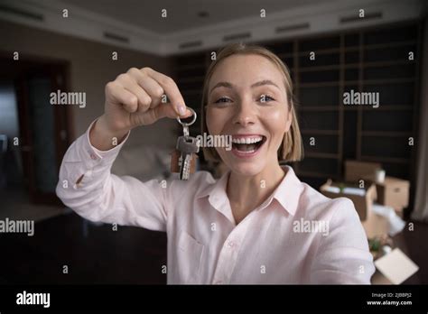 happy female  renter  flat showing keys  camera stock photo alamy