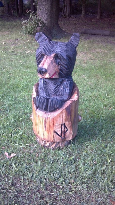 custom rustic black bear in tree stump by parrish chainsaw carving