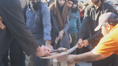 new isis video sees thugs chop off the hand of a thief