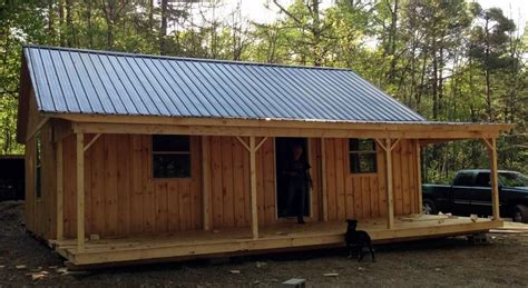 cabin   porch windows  metal roof hand   delivered amish sheds