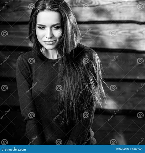 Young Sensual And Beauty Brunette Woman Pose On Wooden Background Black