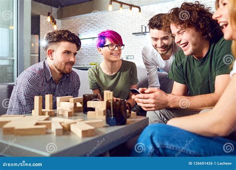 cheerful group  friends play board games stock photo image