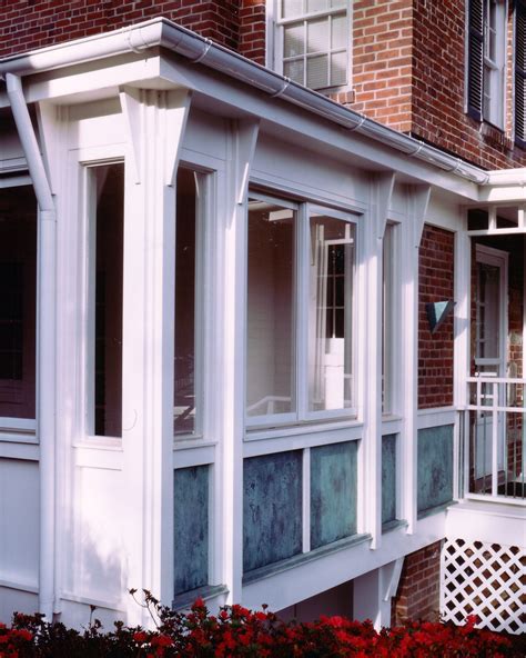 copper patina enlivens   season room  front porch residential architecture