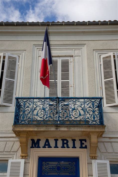 city hall facade  mairie text means  french mayor town hall  france  flag stock