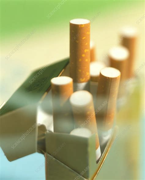 packet of cigarettes seen through a haze of smoke stock image m370