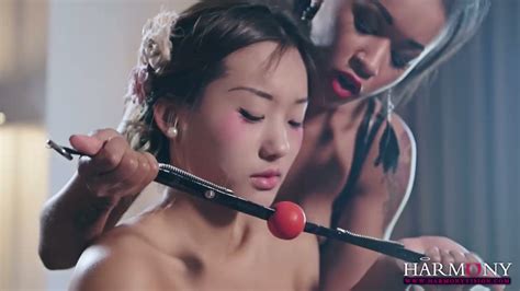 Two Lesbians Make Use Of Ball Gag And Strapon To Punish Chinese Babe
