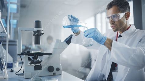 scientist mixing chemicals stock image  science photo library
