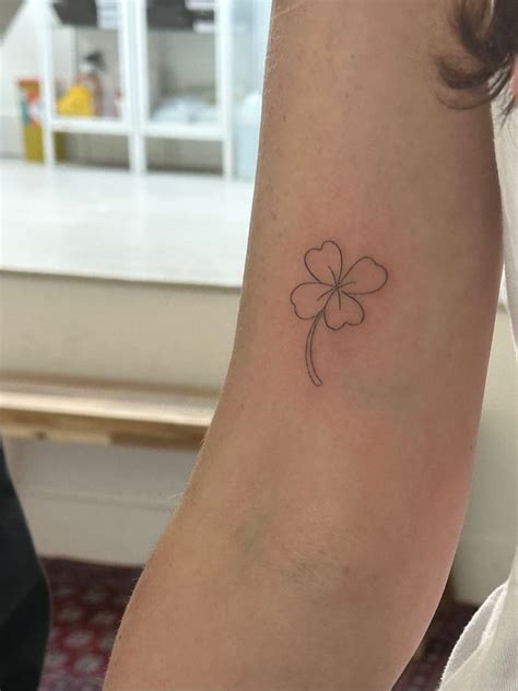 small  leaf clover tattoo   arm