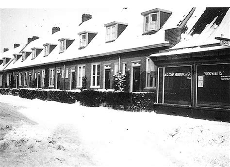black  white photograph  snow covered buildings