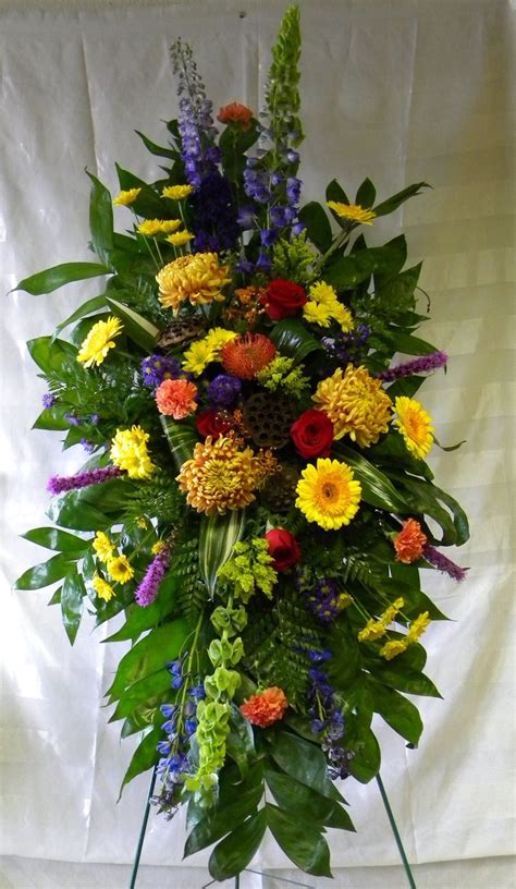 Masculine And Fall Funeral Standing Spray Of Flowers By
