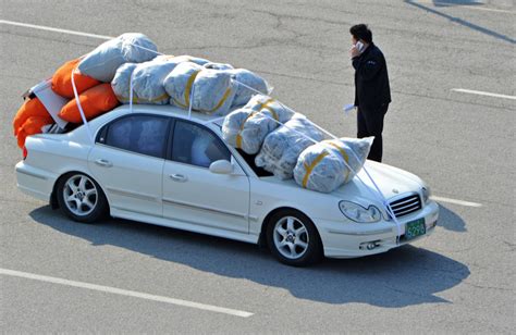 overloaded cars  south korean workers fleeing north