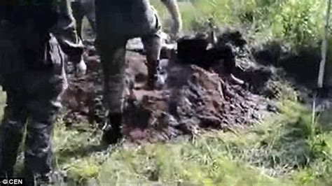 video shows soldiers burying  man alive  ukraine daily mail