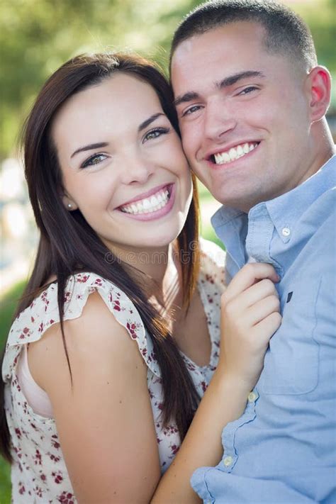 Cute Mixed Race Romantic Couple Portrait In The Park Stock Image