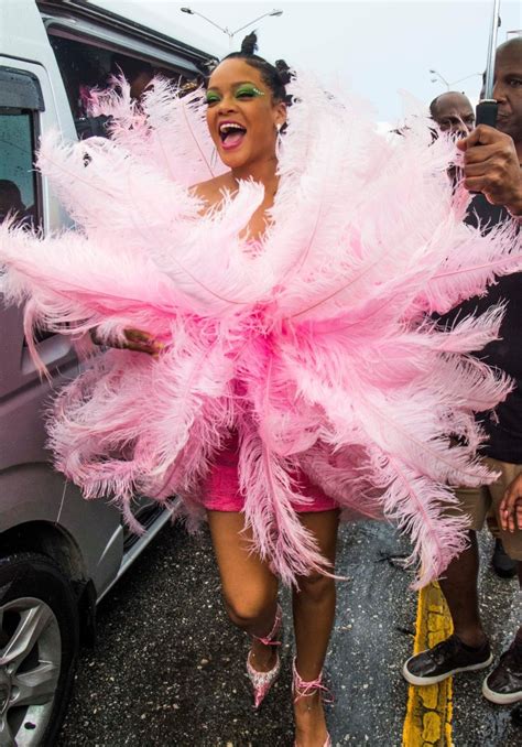 rihanna spotted in massive pink feathers at crop over in
