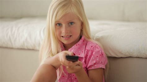 adorable child happily holding remote stock footage sbv