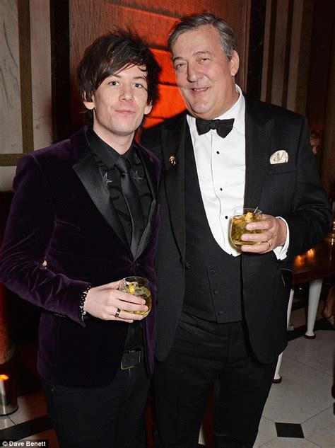 newlyweds stephen fry and elliott spencer put on an affectionate