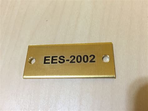 laser cutz brass metal tags fiber laser engraved  laguardia airport  nyc
