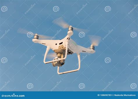 landing  droned hand  spinning propellers flying drone   sky stock image image