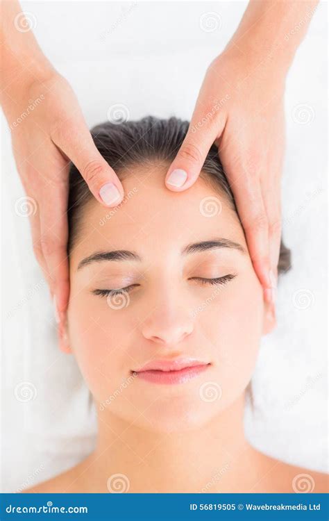 Attractive Young Woman Receiving Head Massage At Spa Center Stock Image