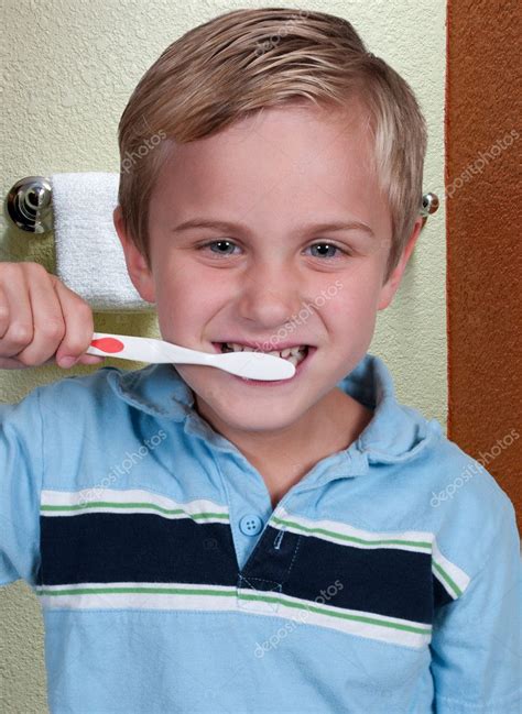 boy brushing teeth stock photo  robeo