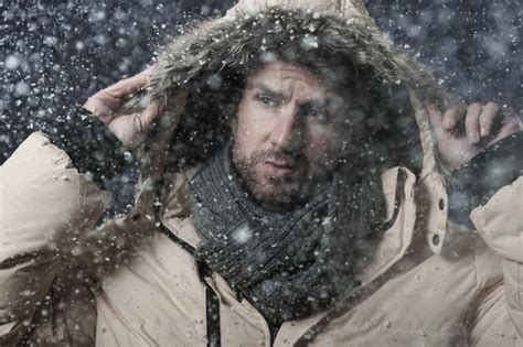 photo man wearing  winter jacket   snowing