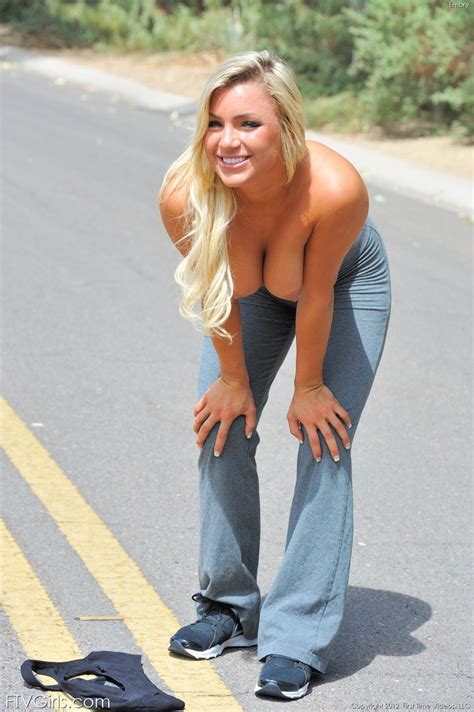 long legged fitness girl strips on the street to stretch