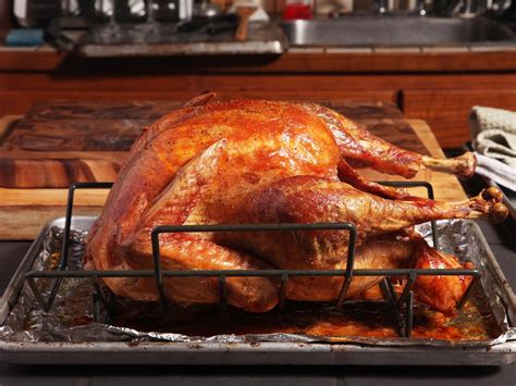 the food lab roasting turkey throw out your roasting pan and reach for your baking stone