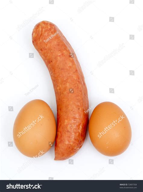 Eggs And Sausage Ordered Like Penis And Testicles Isolated On White