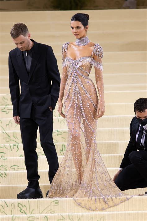 kendall jenner in sheer givenchy gown and thong heels at met gala 2021