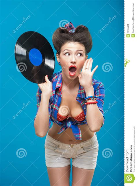 the vintage photo of girl holding vinyl record stock