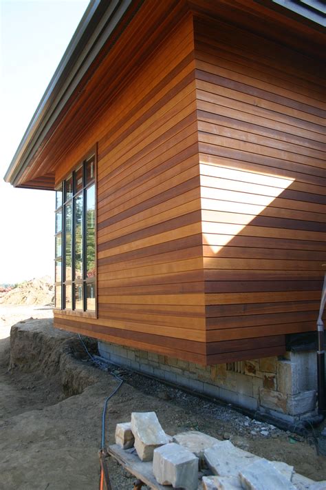 The Side Of A House Being Built With Wood Siding