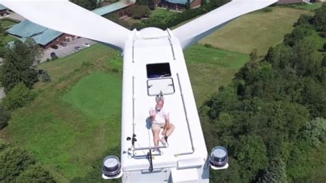 monk sunbathing  wind turbine captured  drone camera cbc news