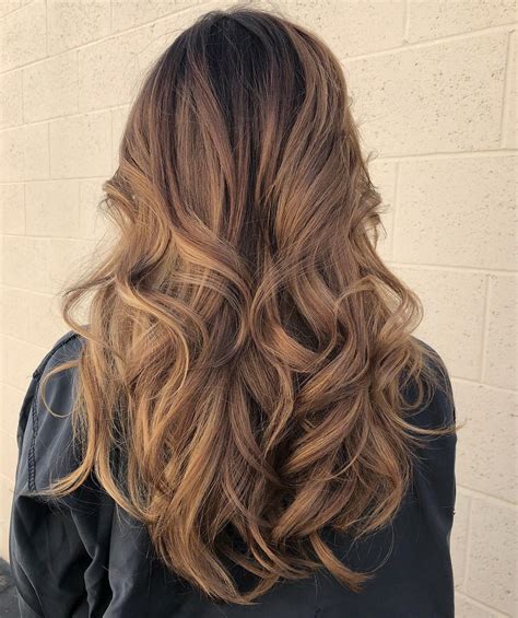 layered hairstyles with soft flipped out curls wavy haircut